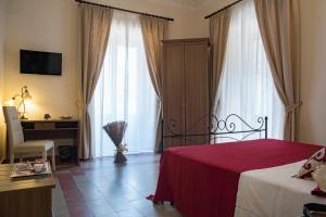 Posteľ alebo postele v izbe v ubytovaní B&B Palazzo Tornabene