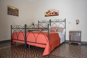 Posteľ alebo postele v izbe v ubytovaní B&B Palazzo Tornabene