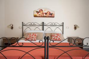 Posteľ alebo postele v izbe v ubytovaní B&B Palazzo Tornabene
