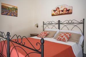 Posteľ alebo postele v izbe v ubytovaní B&B Palazzo Tornabene