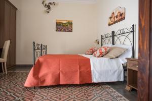 Posteľ alebo postele v izbe v ubytovaní B&B Palazzo Tornabene
