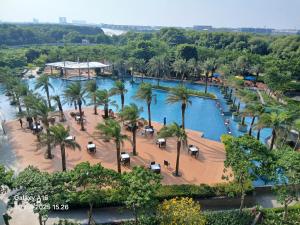 an aerial view of a pool at a resort at Apartment Studio Gold Coast PIK Tower Carribean in Jakarta