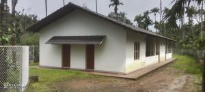 a small white house with a fence around it at Thota'dha Tent Stay in SanivÄrsante