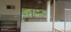 a room with a large window in a building at Thota'dha Tent Stay in SanivÄrsante