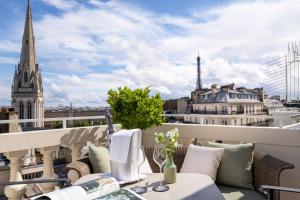a balcony with a view of the city at Hôtel De Sers Champs Elysées Paris in Paris