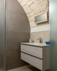 a bathroom with a sink and a mirror at Lanucara 5 in Martina Franca +21 photos