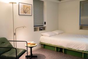 Postel nebo postele na pokoji v ubytování SSH ES Dream tower