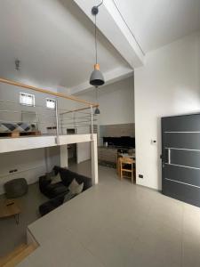 a living room with a couch and a table at Casa Terranova in Pozzallo +8 photos
