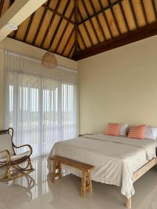 Postel nebo postele na pokoji v ubytování The Casa Kirana