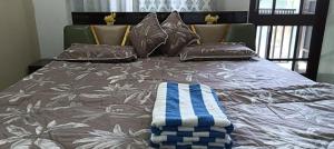 Postel nebo postele na pokoji v ubytování Pooja homestay