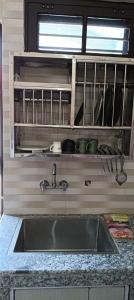 Kuchyň nebo kuchyňský kout v ubytování Pooja homestay