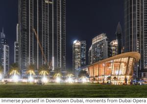 a view of a city at night with buildings at Hotel Boulevard, Autograph Collection, Downtown Dubai in Dubai