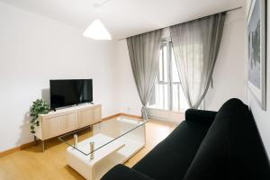 โทรทัศน์และ/หรือระบบความบันเทิงของ Corporate accommodation in Leganés 3 rooms 5 people +4 ภาพ