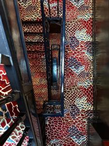 a staircase with a wall covered in graffiti at Maison Muse Sablon in Brussels