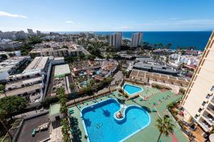 an aerial view of a resort with a swimming pool at Beach apartment in Las Americas in Arona