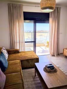 a living room with a couch and a table at נחת רוח Nachat Ruach in Mitzpe Ramon