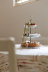 a group of donuts sitting on top of a table at B Luxury Home in Castellammare di Stabia