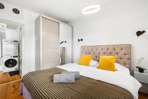 En eller flere senge i et værelse på Blue Horizon