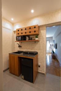 a kitchen with a stove and a counter top at The Grand Mirror in Cairo