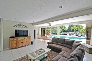a living room with a couch and a tv at Edgemere in Siesta Key