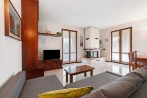 a living room with a couch and a table at Casa Lago - Dongo in Dongo