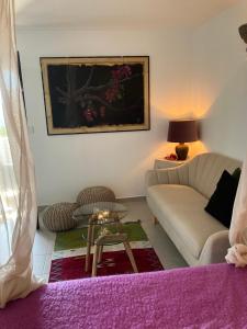 a living room with a couch and a table at La Ladera Bay View in La Herradura
