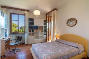 Ένα ή περισσότερα κρεβάτια σε δωμάτιο στο Villa Cinzia