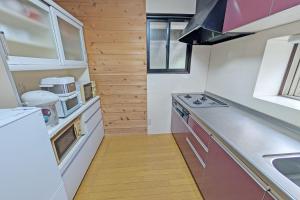 Kuchyň nebo kuchyňský kout v ubytování グリーンビューコテージ那須 + 12 fotografií