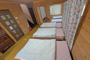 Postel nebo postele na pokoji v ubytování グリーンビューコテージ那須