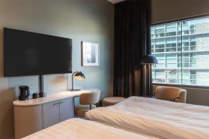 Postel nebo postele na pokoji v ubytování Scandic Helsinki Station