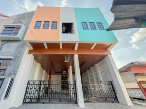 a house with a view of the front of it at Urbanview Hotel Simple near Pakuwon Mall Jogja in Seturan