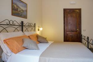 Posteľ alebo postele v izbe v ubytovaní B&B Palazzo Tornabene