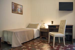 Posteľ alebo postele v izbe v ubytovaní B&B Palazzo Tornabene