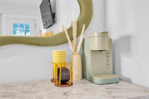 a kitchen counter with a hair dryer and a blender at Modern Studio Unit Near Downtown, King Bed, WiFi in Austin