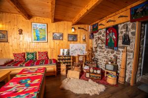 a living room with a couch and a tv at Seosko domacinstvo Jahova voda - Muratovići in Petnjica +62 photos