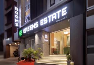 a store front with a sign for the cleaners institute at GREENS ESTATE Business Class Hotel in Chennai