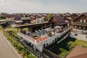 an aerial view of a house with a balcony at Suzanne Băile Figa- camere hotel in Beclean