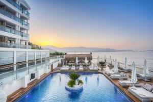 a view of the pool on the oceanfront of a resort at Meis Exclusive Hotel in Kaş