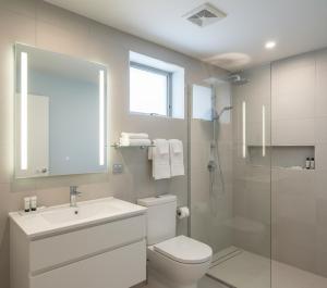 a bathroom with a toilet and a sink and a shower at Arsuz Paart Otel in Arsuz