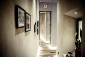 a hallway with pictures on the walls of a room at Benci House in Florence +110 photos