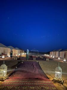 a tent in a desert at night at Desert Mhamid in Mhamid +23 photos