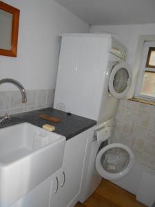 a small bathroom with a toilet and a sink at The Barn - Wheatley - Oxford in Wheatley +27 photos