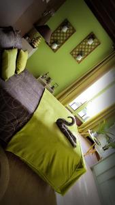 a bedroom with a bed with a banana on it at Chambre zen in Motteux
