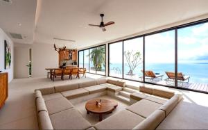 a living room with a large couch and a table at Anzhu Seamate Villa Samui in Lamai +244 photos