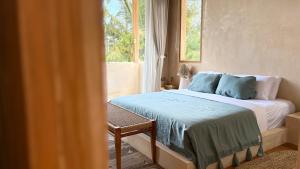a bedroom with a bed and a window at MINTU Villa Uluwatu - BBQ, Private Pool & Concierge Service in Bingin Beach +44 photos