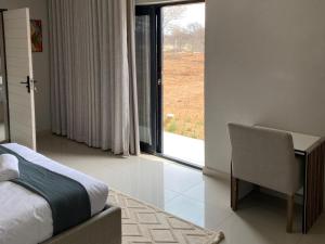 Ένα ή περισσότερα κρεβάτια σε δωμάτιο στο Alldays Country Lodge