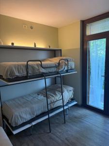 Postel nebo postele na pokoji v ubytování I Fiori del Lago Apartment