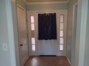 a room with a door with a black curtain on it at Cozy Brickhouse Indiana Village in Lincoln