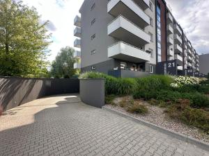 a apartment building with a walkway in front of it at Czartoryskiego Apart - Self Check-In 20h - Parking &Lift & 50m Terrace in Wrocław