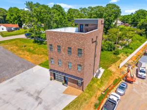 an overhead view of a brick building with a parking lot at The Spot 281 Liberty Pkwy in Clarksville +52 photos